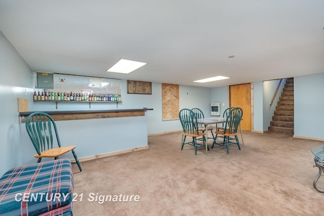 dining space with heating unit, stairs, baseboards, and carpet floors