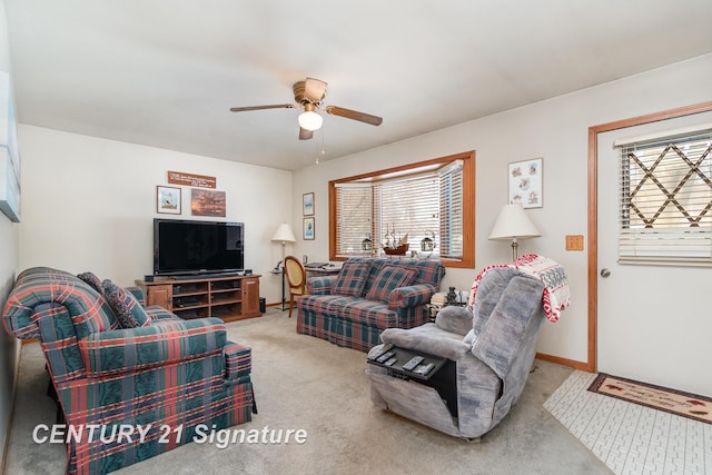 living room featuring baseboards, carpet, and ceiling fan