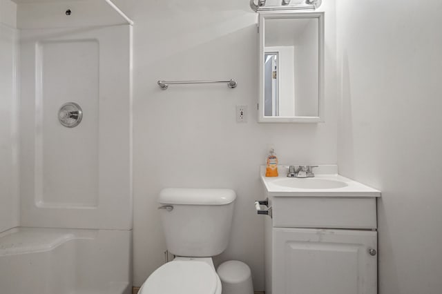 full bath with vanity, toilet, and a shower