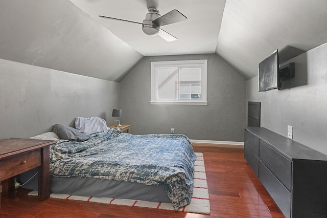 bedroom with baseboards, wood finished floors, a ceiling fan, and vaulted ceiling