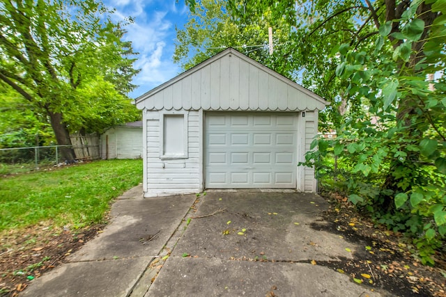 5984 Courville St, Detroit, MI 48224 - detached garage featuring driveway and fence