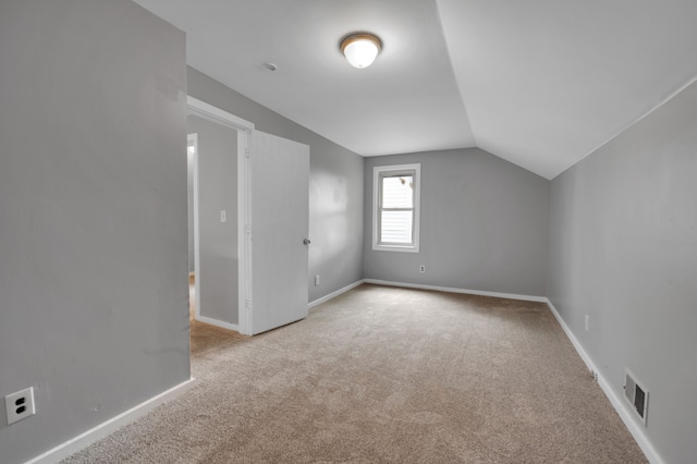 5984 Courville St, Detroit, MI 48224 - bonus room featuring visible vents, baseboards, lofted ceiling, and carpet floors