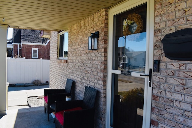 view of patio / terrace featuring fence