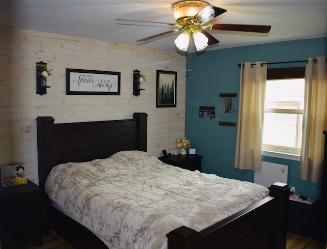 bedroom featuring radiator and a ceiling fan