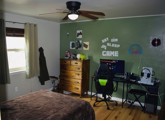 bedroom featuring ceiling fan and wood finished floors