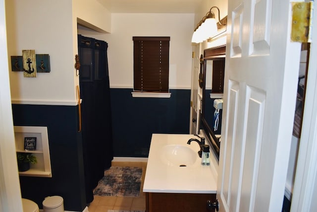 bathroom with vanity, tile patterned floors, and toilet