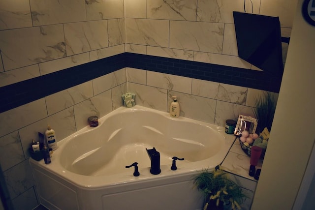 full bathroom with a bath and tile walls