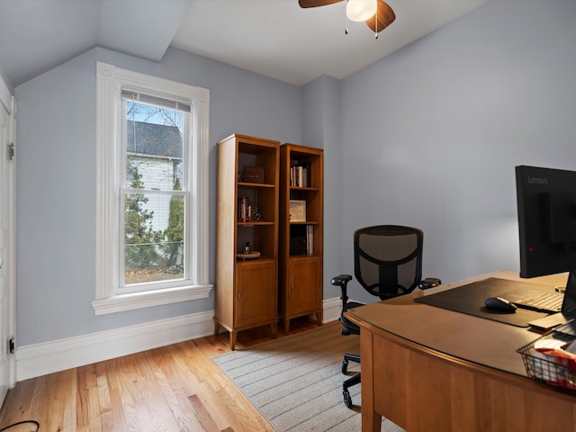 office area with ceiling fan, plenty of natural light, light wood-style flooring, and vaulted ceiling