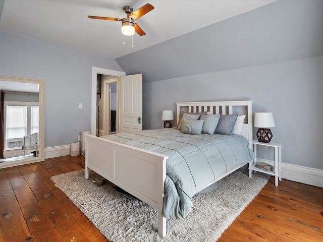 bedroom with ceiling fan, lofted ceiling, baseboards, and hardwood / wood-style floors