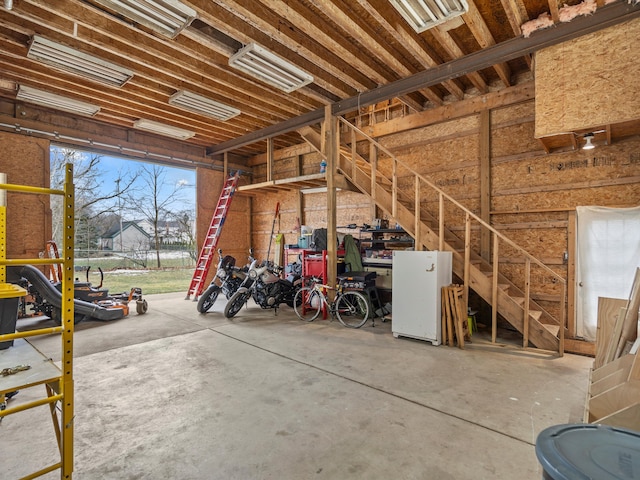 garage with freestanding refrigerator