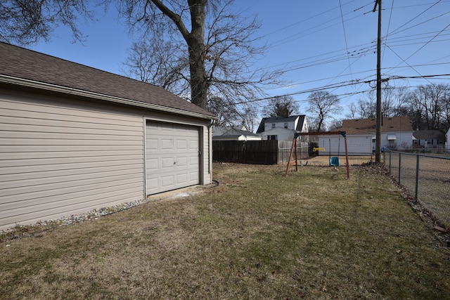 view of yard featuring driveway and a fenced backyard