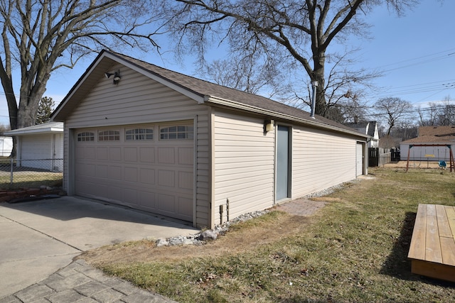 detached garage featuring fence