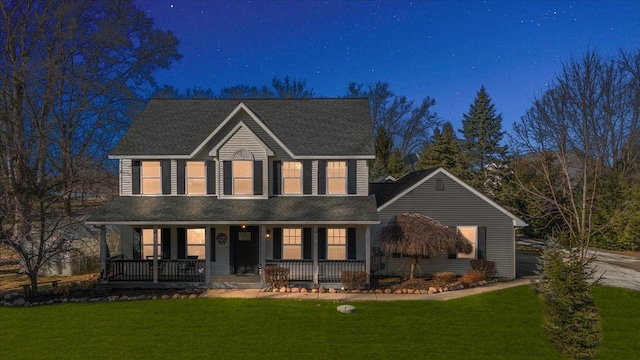 view of front of house featuring covered porch and a front yard