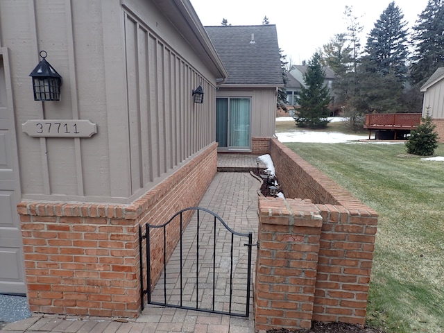 view of patio with fence and a gate