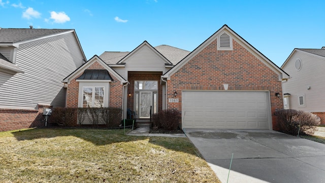 view of front of house featuring driveway, a front yard, a shingled roof, a garage, and brick siding