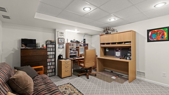 office featuring light carpet, visible vents, and baseboards