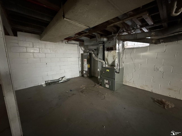 unfinished basement with heating unit and gas water heater