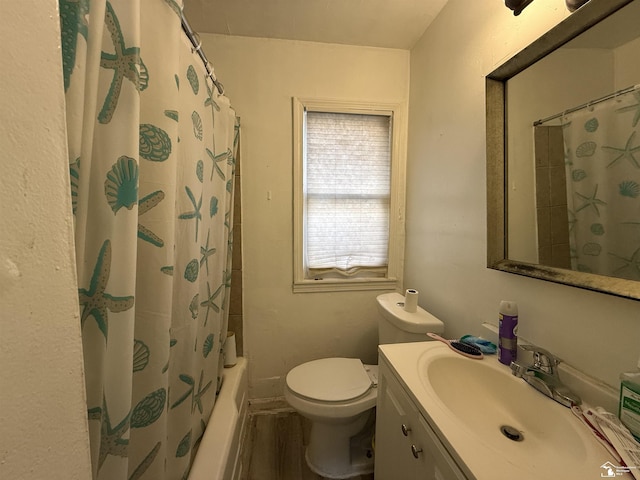 full bathroom with shower / bath combo with shower curtain, toilet, and vanity