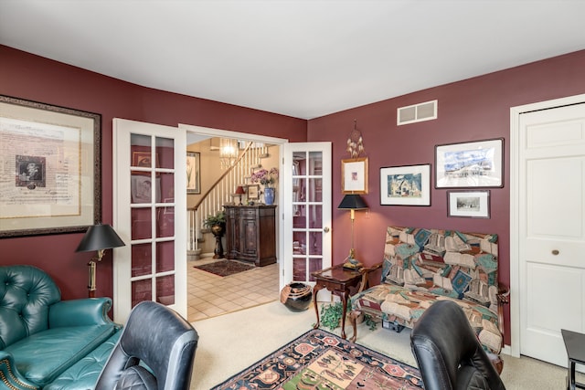 office with french doors, carpet floors, and visible vents