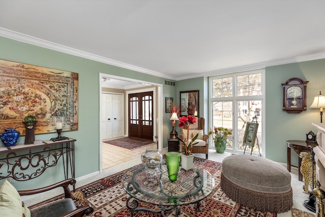 living area with visible vents, baseboards, carpet floors, and crown molding