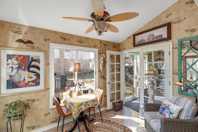 sunroom featuring a ceiling fan and vaulted ceiling