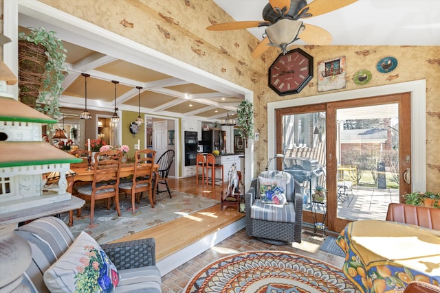 living room with beamed ceiling, recessed lighting, brick floor, and ceiling fan