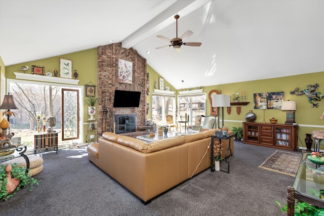 carpeted living area featuring a ceiling fan, beamed ceiling, a fireplace, and high vaulted ceiling