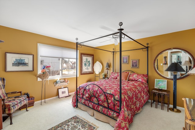 bedroom featuring baseboards and carpet