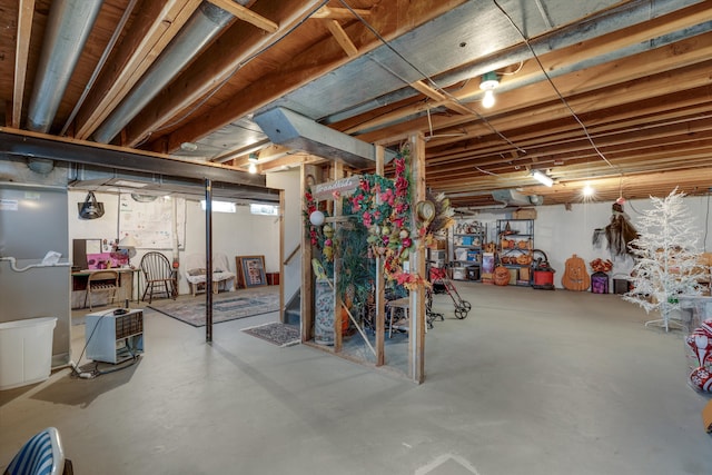 unfinished basement featuring stairs