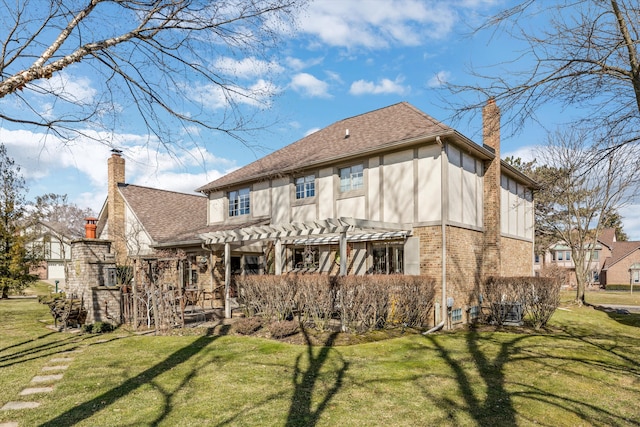 back of property featuring stucco siding, a chimney, a yard, and a pergola