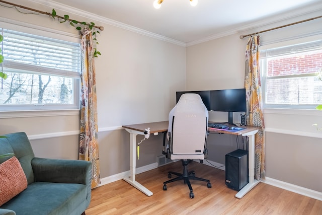 office space featuring crown molding, baseboards, and wood finished floors