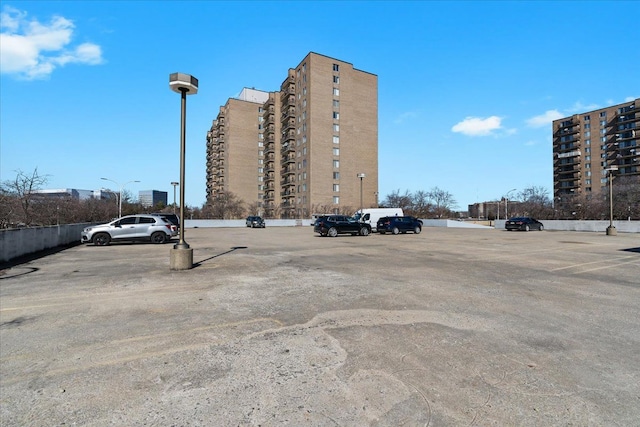 view of building exterior featuring uncovered parking