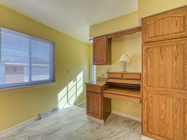 home office with visible vents, marble finish floor, and baseboards