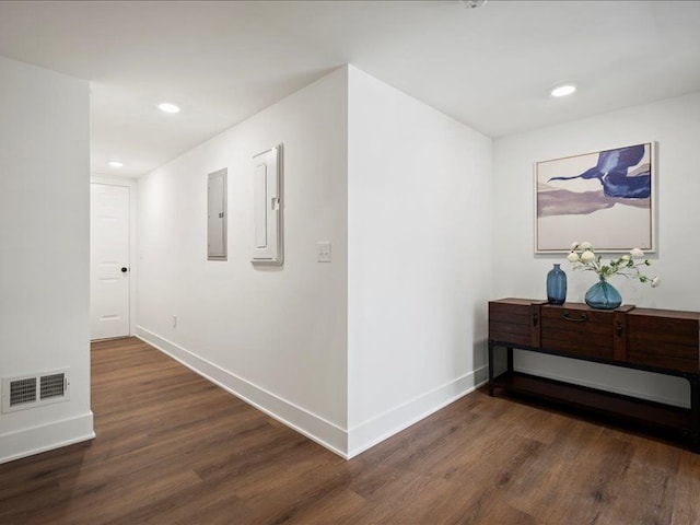 545 Village Ln, Milford, MI 48381 - corridor with electric panel, visible vents, dark wood-style flooring, and baseboards