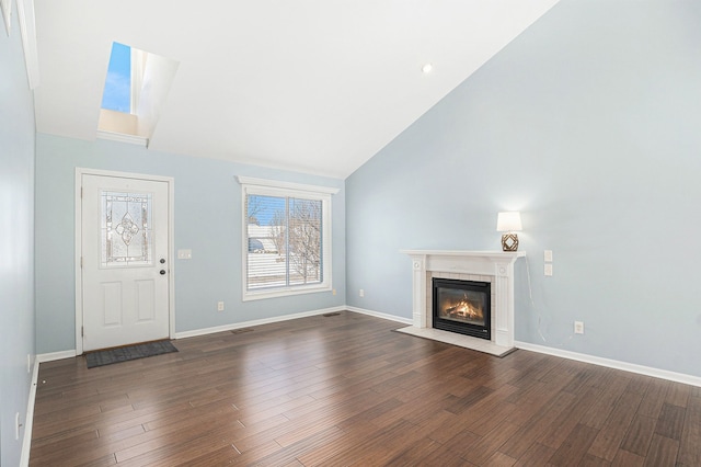 unfurnished living room with high vaulted ceiling, baseboards, dark wood-type flooring, and a tiled fireplace