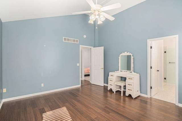 bedroom featuring visible vents, high vaulted ceiling, wood finished floors, baseboards, and ceiling fan