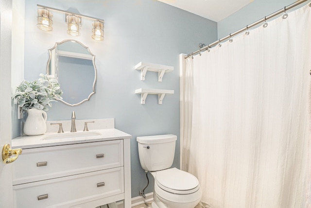 full bathroom featuring vanity and toilet