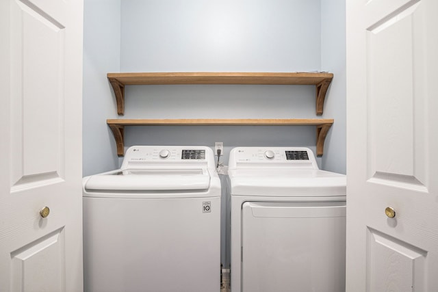 washroom with laundry area and washer and dryer