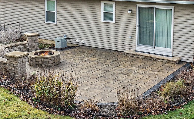 view of patio / terrace with an outdoor fire pit