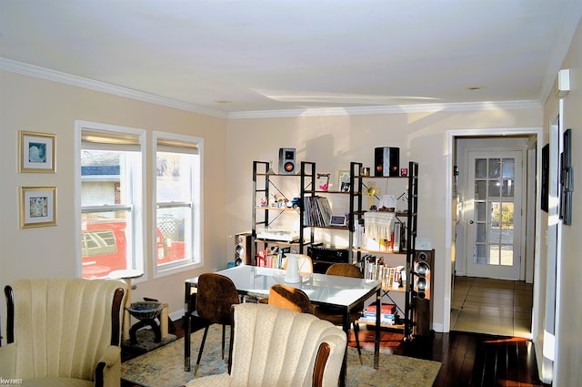 dining space featuring ornamental molding, baseboards, and dark wood-style flooring