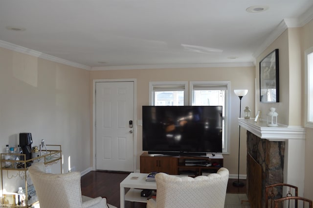 living room with baseboards, wood finished floors, and crown molding