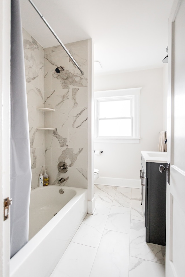 bathroom with toilet, marble finish floor, shower / bath combination with curtain, baseboards, and vanity