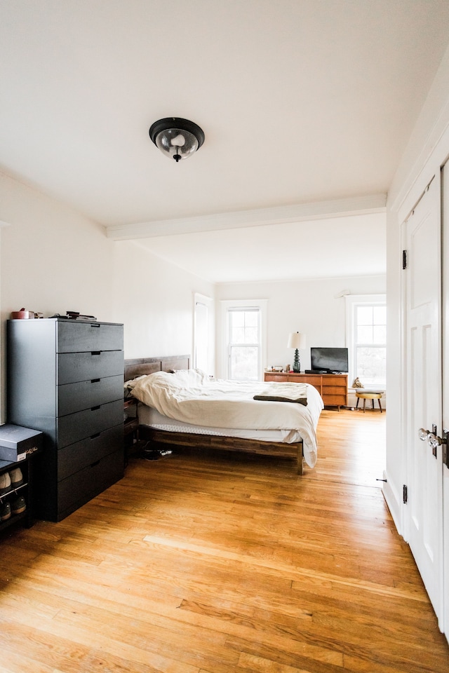 bedroom with light wood finished floors