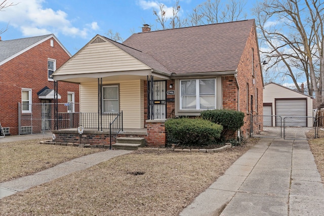 bungalow-style home with brick siding, a detached garage, a porch, a chimney, and a gate