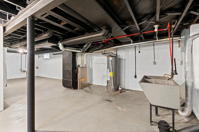 unfinished basement with a sink, heating unit, and water heater