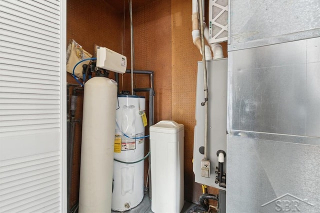 utility room with water heater