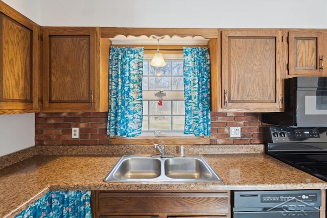 kitchen with brown cabinetry, backsplash, black appliances, and a sink