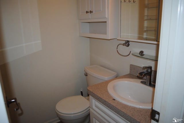 bathroom with toilet and vanity