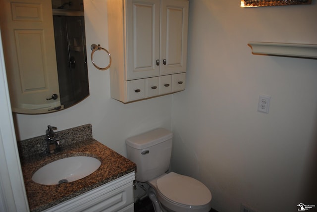 half bath with vanity and toilet