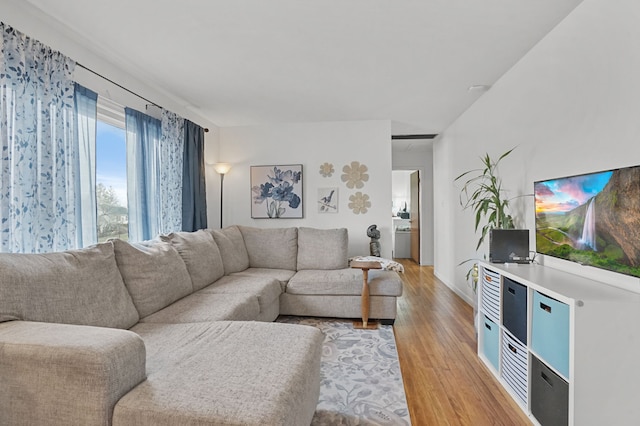 living room with light wood finished floors and washer / clothes dryer